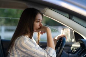 drunk-girl-driving-car-unhappy-tired-young-female